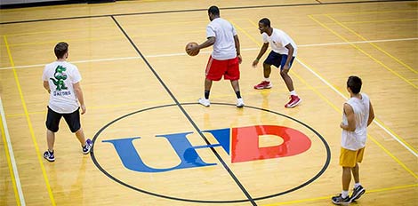 students playing basketball at UHD